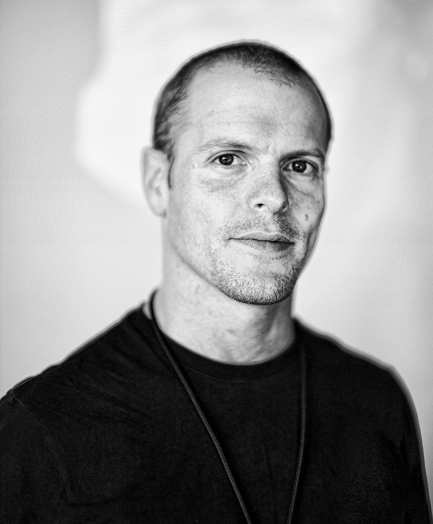 Black and white portrait of Tim Ferris.