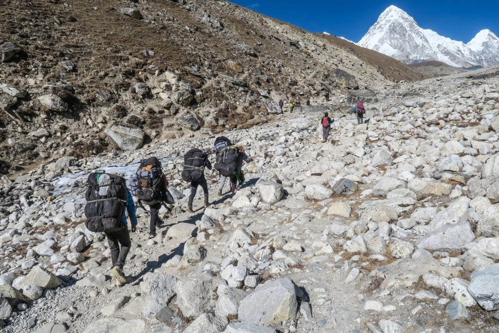 Group of people trekking up a mountain,