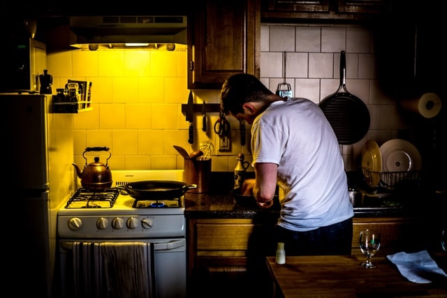 A man cooking in his kitchen.
