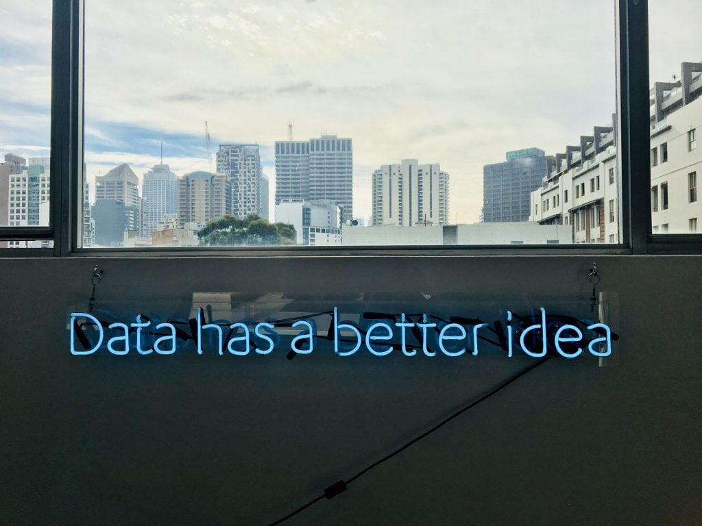 Fluorescent sign on a wall spelling out the words 'Data has a better idea'. 