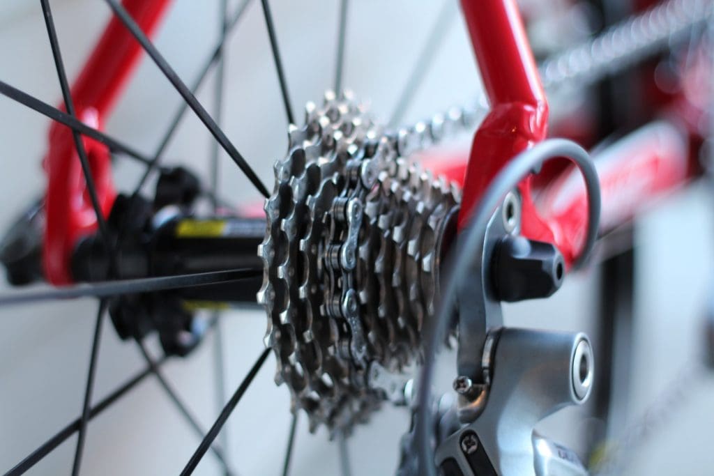 Shallow focus shot of gears and chain on racing bike.