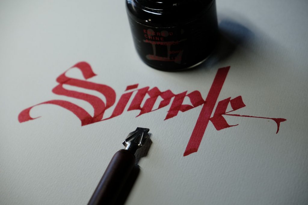 the word 'simple' written in calligraphy